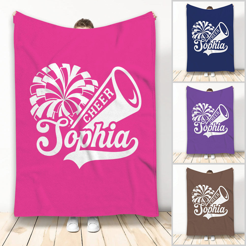 Cheerleading throw blanket with white pom-pom and megaphone artwork in pink, navy, purple, and brown