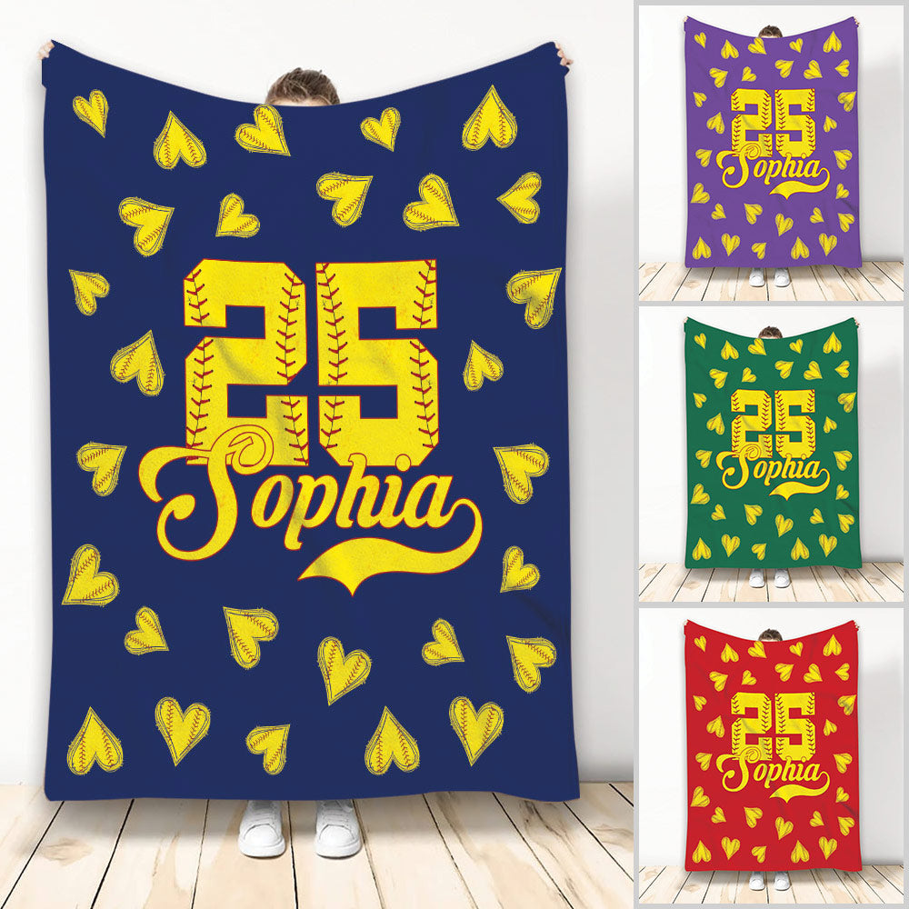 Softball blanket shown upright with yellow softball hearts, bold jersey-style artwork, and multiple background colors