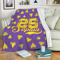 Softball throw blanket displayed on a sofa with yellow stitched hearts and a bold jersey-style sports design