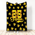 Black softball throw blanket displayed with a repeating yellow softball heart pattern