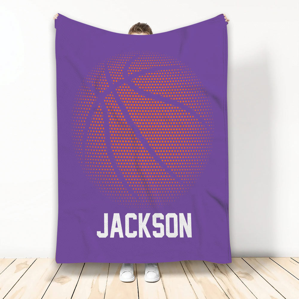 Purple basketball blanket displayed upright with a large dotted orange basketball design