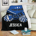 Blue and black cheerleading throw blanket displayed on a sofa with pom-poms and megaphone artwork