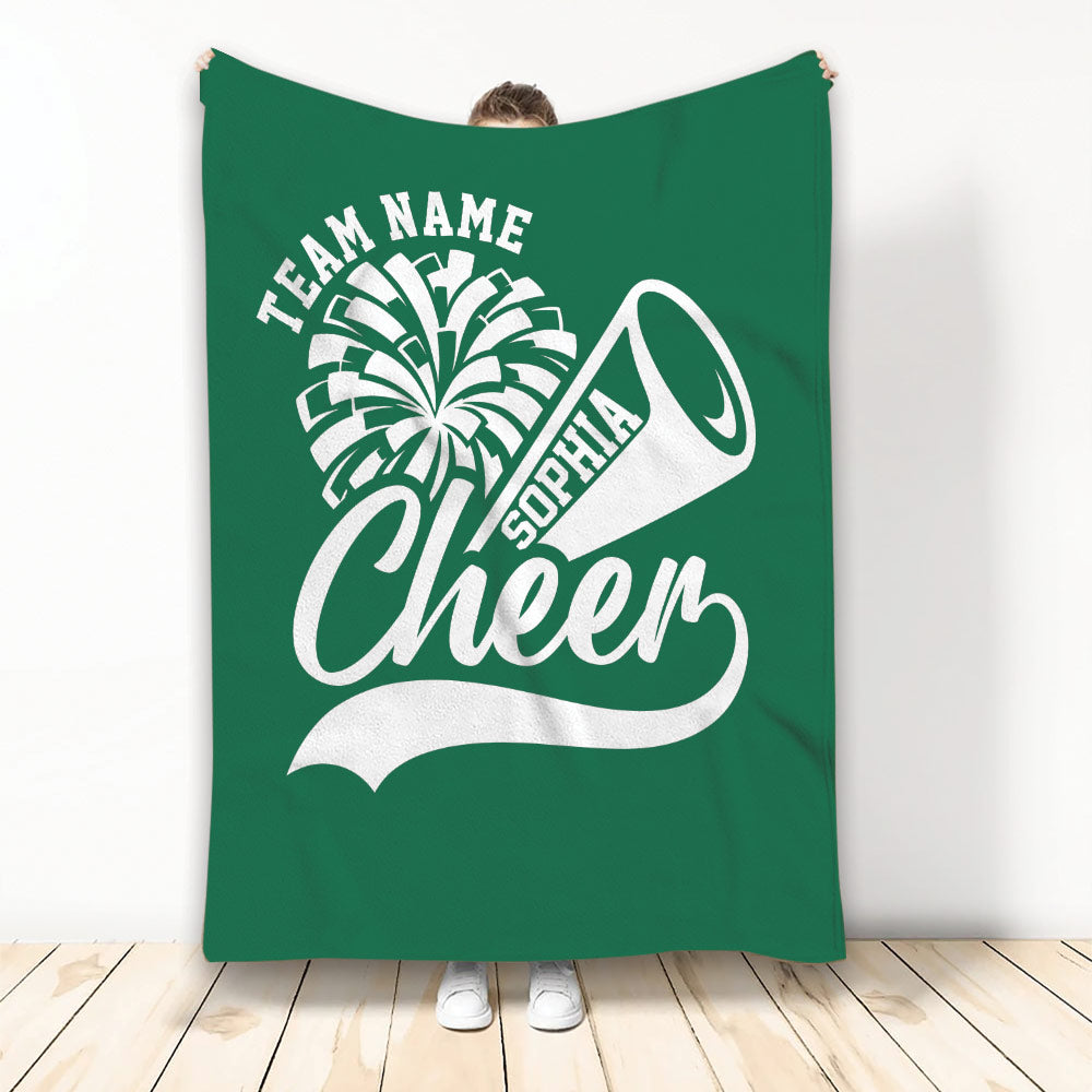 Green cheerleading throw blanket displaying bold white pom-pom and megaphone graphics