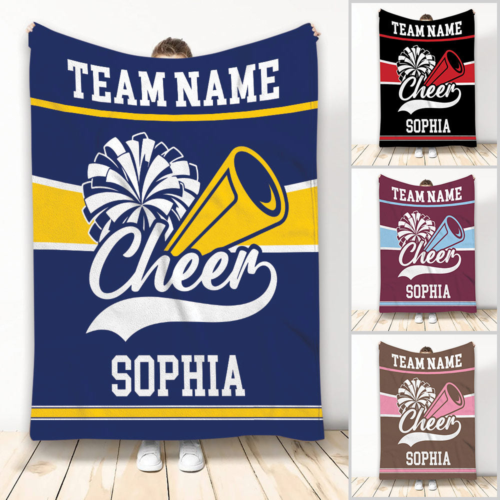 Custom cheerleading blanket displaying pom-poms, megaphone artwork, bold team stripes, and multiple color options