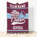 Maroon and light blue cheerleading blanket featuring pom-poms, a megaphone, and bold striped accents