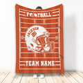 Orange football blanket displayed vertically with a white helmet graphic and athletic field design