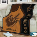 Close view of a sign language throw blanket featuring expressive hand symbols