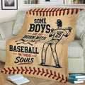 Vintage baseball throw blanket displayed on a couch with ballplayer artwork, baseball, bats, and red stitching