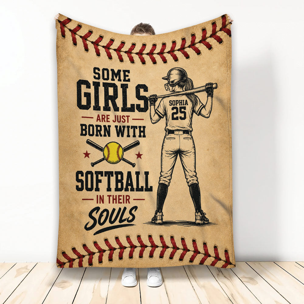 Softball throw blanket with female player artwork, softball imagery, and vintage red and tan stitching border