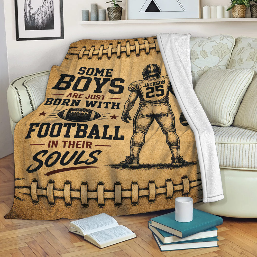 Football throw blanket draped over a sofa with vintage player artwork and brown leather-style graphics