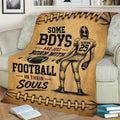 Vintage football blanket displayed on a couch with a helmeted player and football-themed artwork