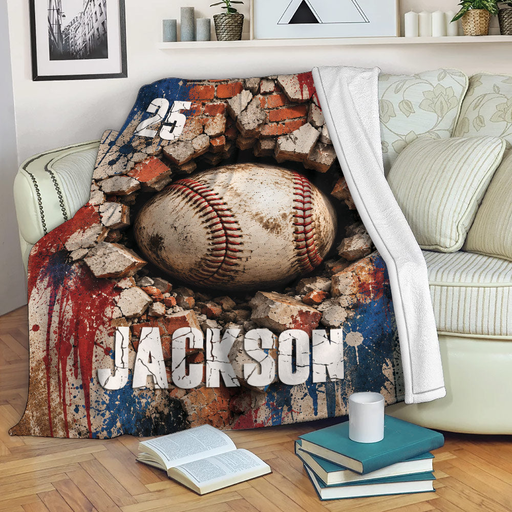 Baseball throw blanket draped over a couch with distressed brick wall and bold sports artwork
