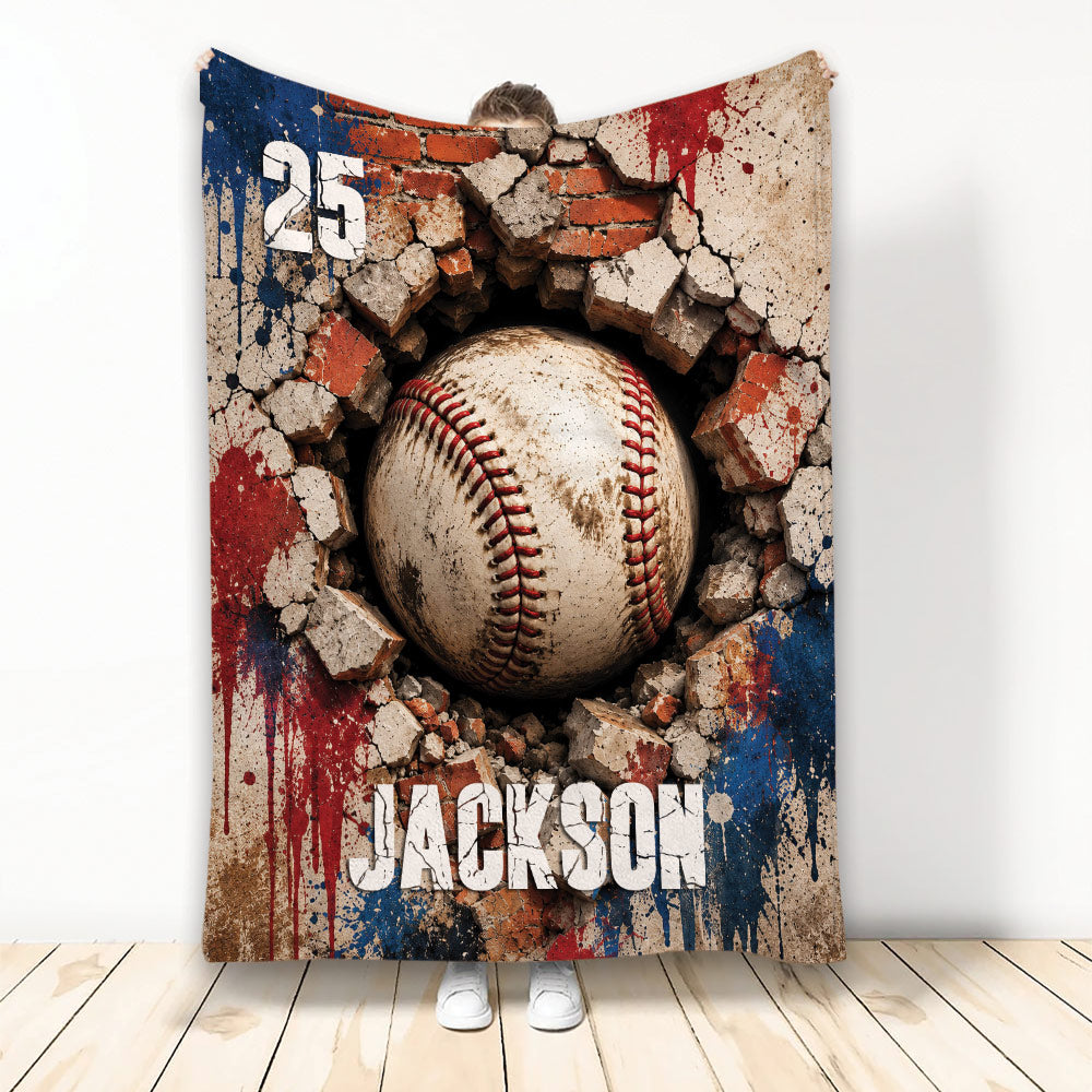 Baseball throw blanket displayed upright with a dramatic ball breaking through a brick wall design