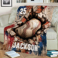 Baseball blanket spread across a sofa featuring a large textured baseball and red, white, and blue design