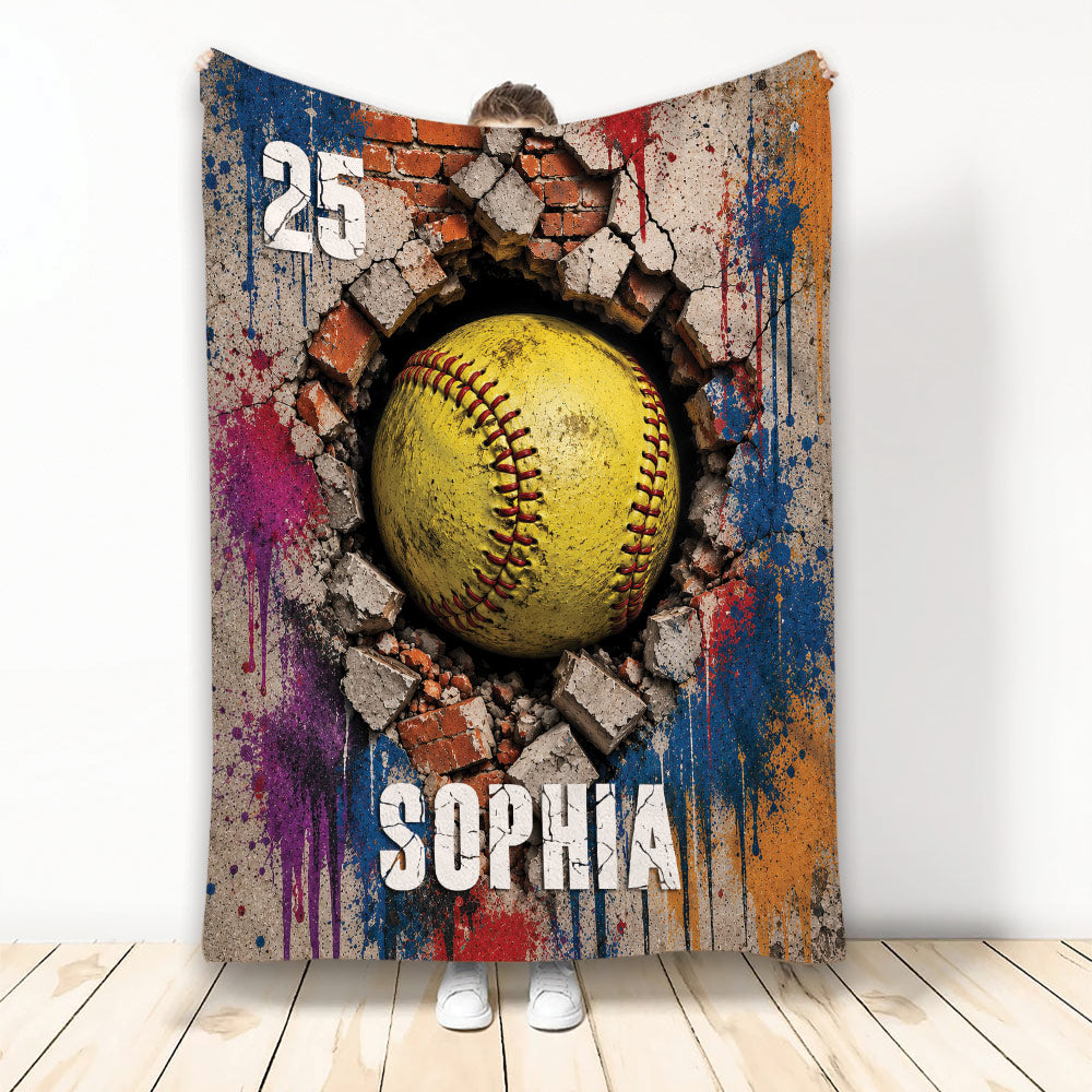 Softball throw blanket featuring a yellow ball breaking through brick with colorful paint splashes