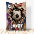 Soccer throw blanket with a distressed ball breaking through brick and colorful paint splashes