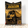 Construction truck blanket featuring a detailed yellow dump truck, work-zone signs, and industrial artwork