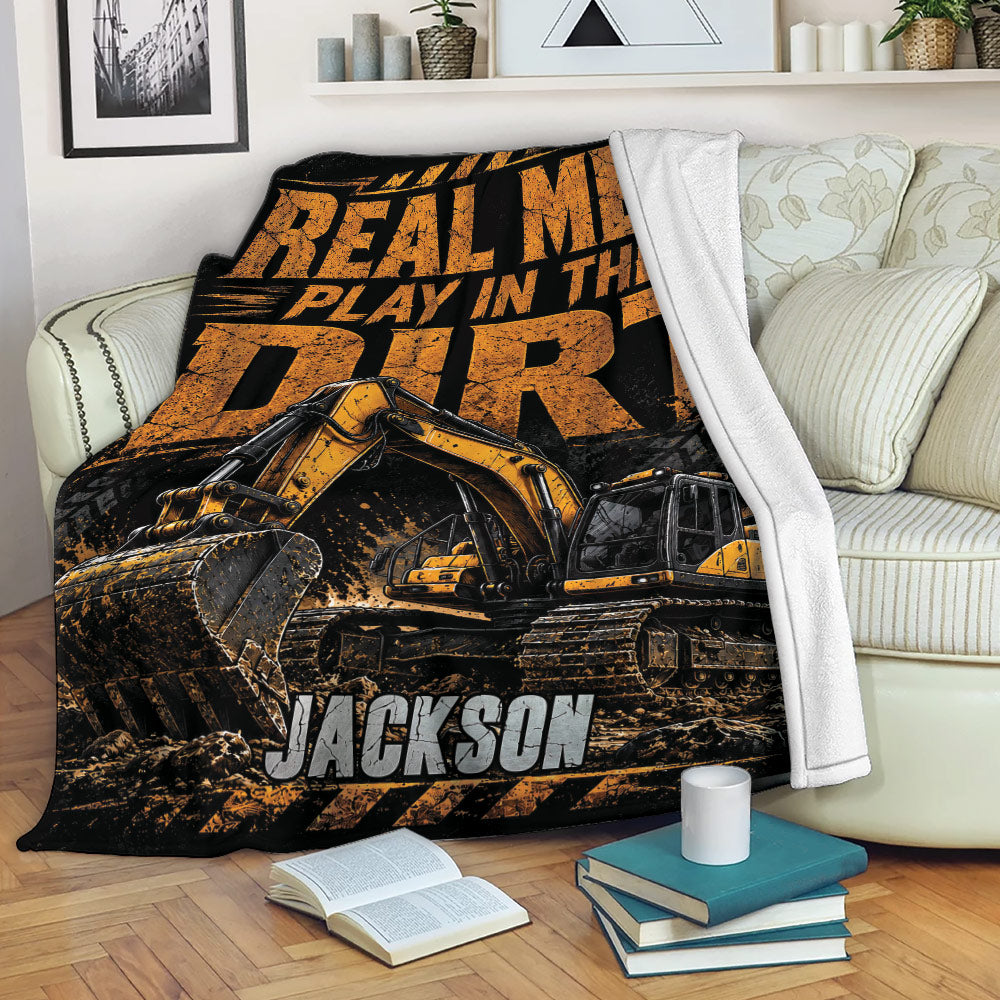 Construction truck throw blanket featuring an excavator design draped over a living room sofa