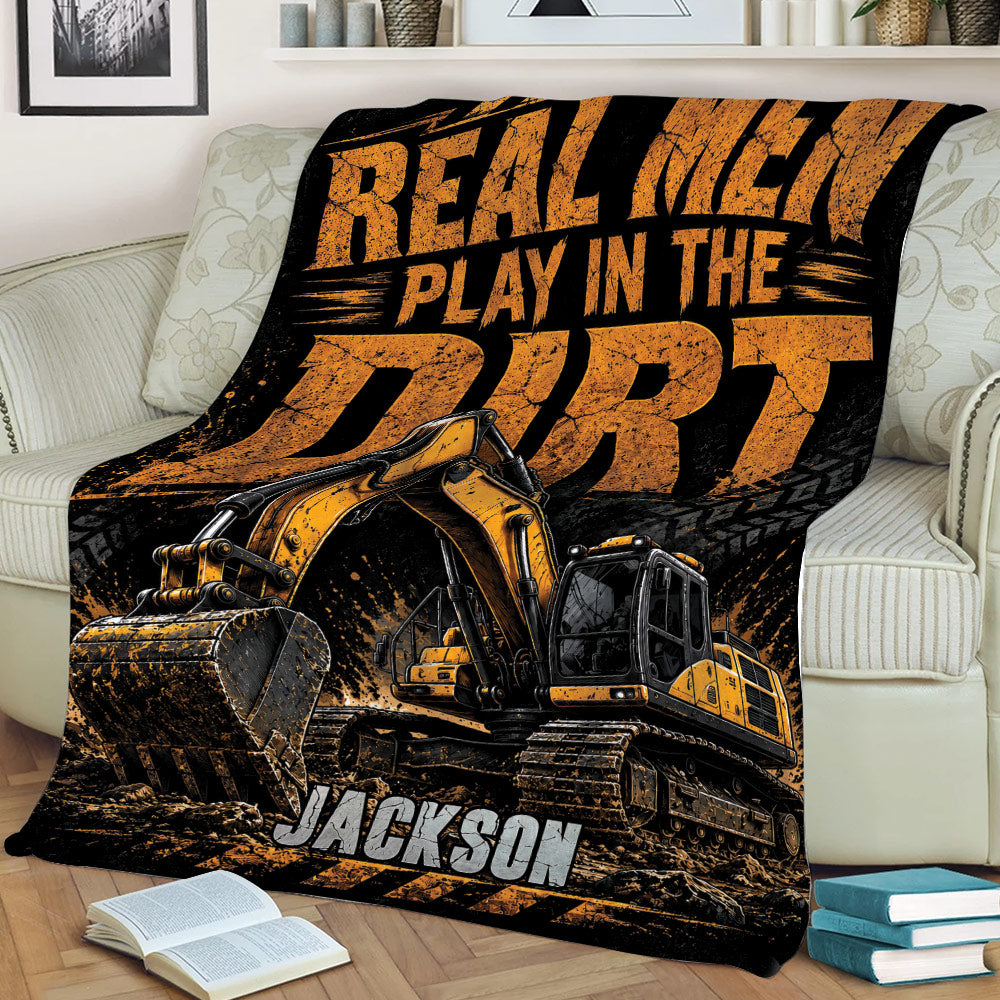 Construction truck blanket with rugged excavator artwork styled across a couch
