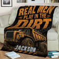 Rugged construction truck throw blanket displayed across a living room sofa