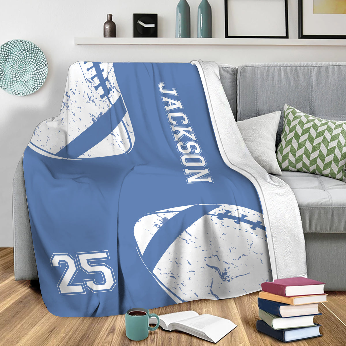 Blue football blanket draped over a sofa in a cozy living room