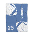 Flat lay of a blue football blanket with distressed white football graphics