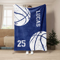 Navy basketball throw blanket shown hanging with distressed white basketball graphics and sporty typography