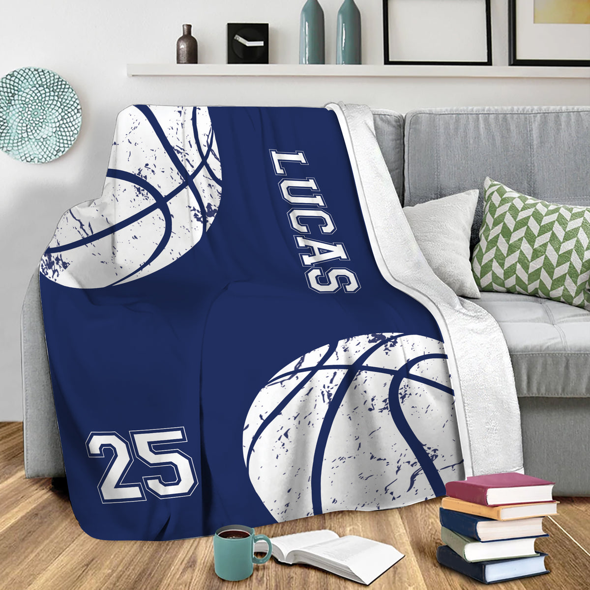 Navy basketball blanket draped over a sofa in a casual sports room setting