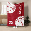 Red basketball throw blanket displayed with large white basketball graphics and sporty jersey-inspired artwork