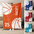 Basketball throw blanket displayed in orange with bold white basketball graphics and athletic jersey-style artwork