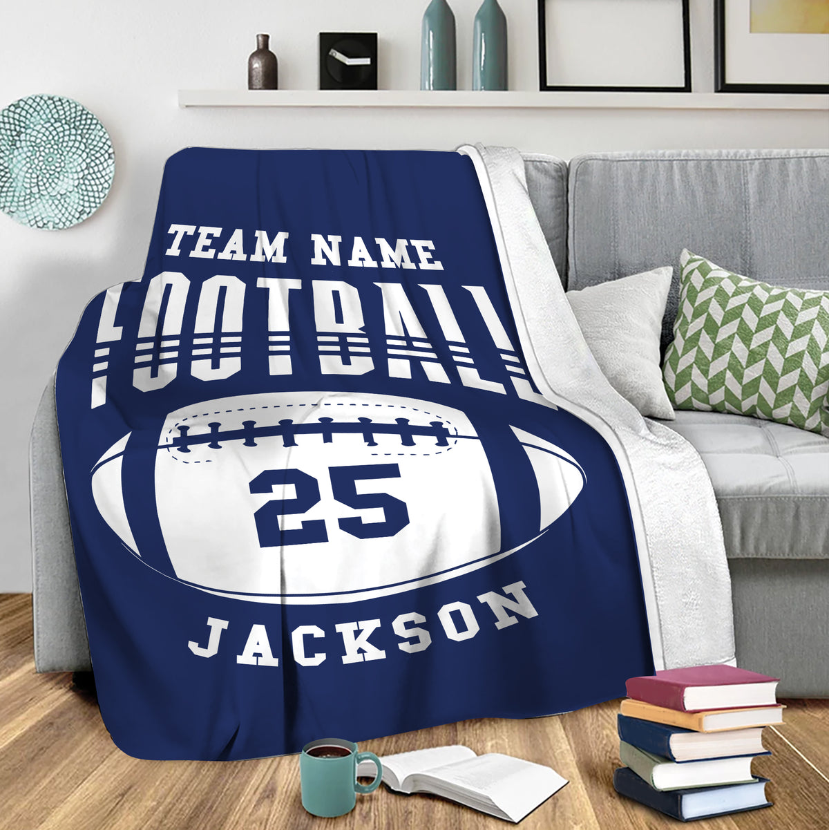 Blue football throw blanket draped over a sofa for cozy sports-themed living room decor