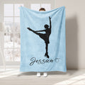 Light blue ice skating blanket featuring a black figure skater silhouette in an elegant pose