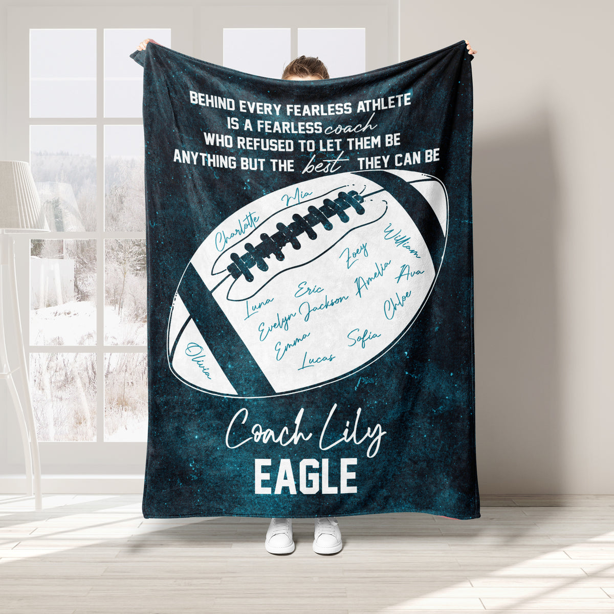 Teal football coach blanket displayed in a bright room with motivational sports artwork