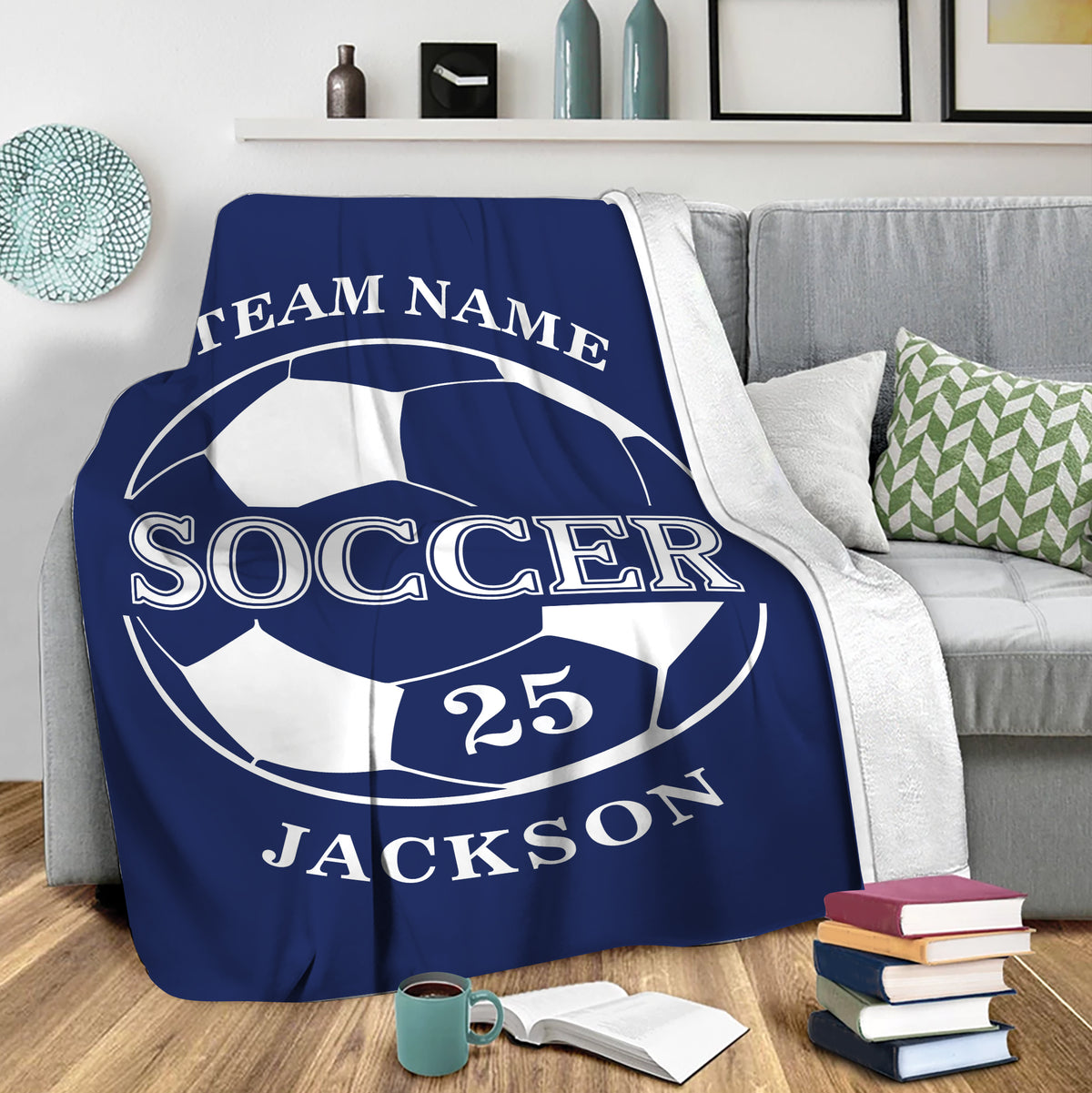 Blue soccer throw blanket draped over a sofa in a cozy living room setting