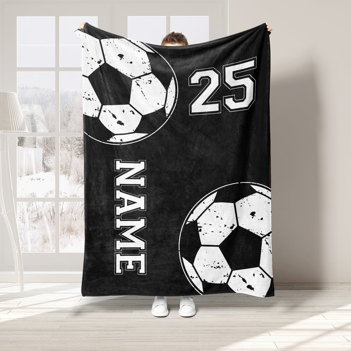 Black soccer throw blanket with distressed ball graphics and bold athletic-style design