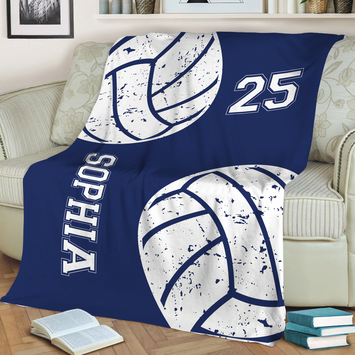Blue volleyball blanket styled on a sofa with bold volleyball graphics for sports-themed room decor
