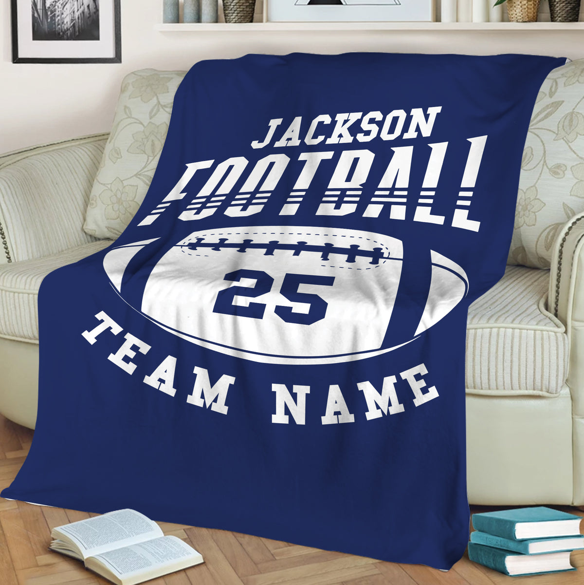 Blue football throw blanket draped over a couch with bold sports lettering and football artwork