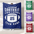 Football throw blanket displayed in multiple team colors with bold sports lettering and oval football artwork