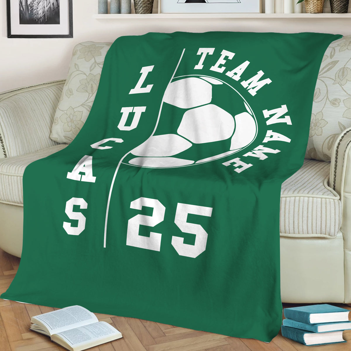 Green soccer throw blanket draped over a sofa, featuring bold white soccer artwork and team-inspired styling