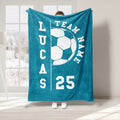 Teal soccer throw blanket with a large white soccer ball graphic and contrasting athletic typography