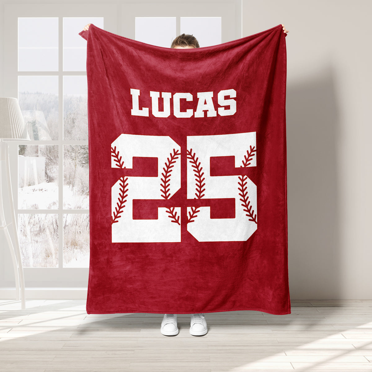 Red baseball throw blanket featuring bold jersey-style artwork with baseball stitching accents