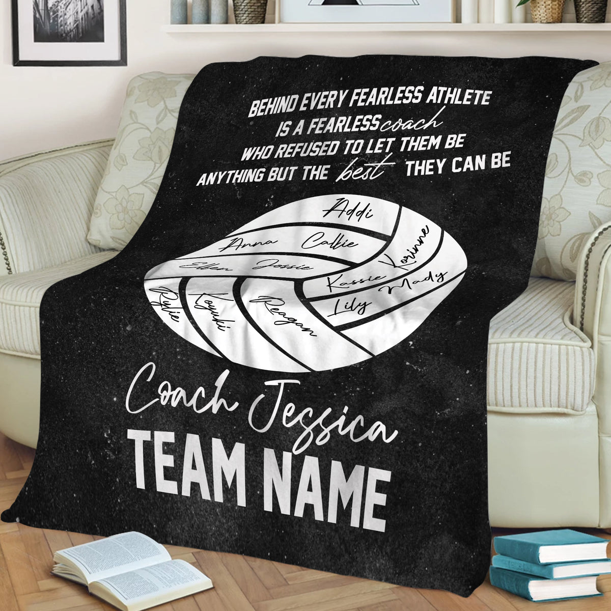 Black volleyball throw blanket draped over a sofa with motivational coach artwork