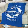 Blue volleyball throw blanket styled across a sofa for cozy sports-themed decor
