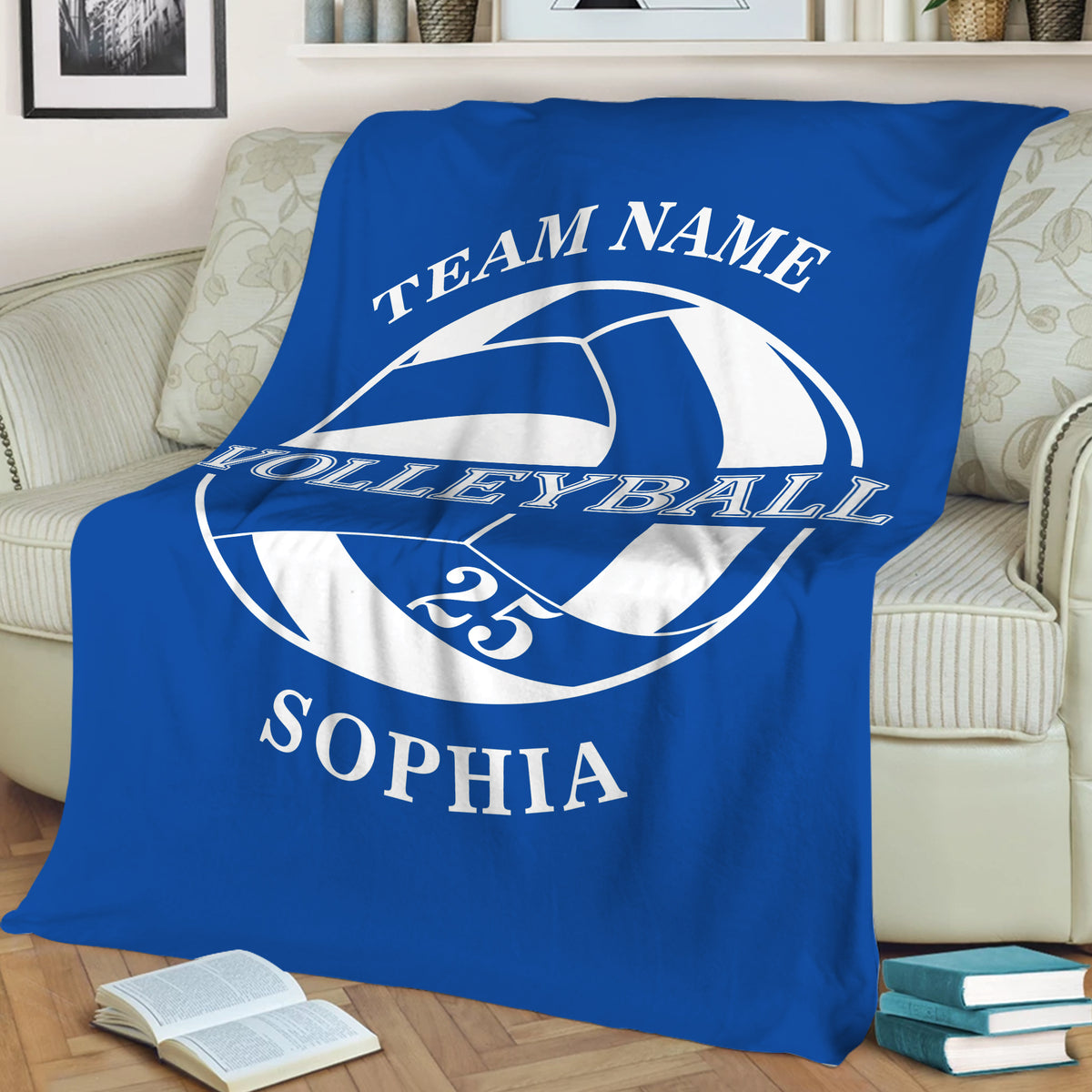 Blue volleyball throw blanket styled across a sofa for cozy sports-themed decor