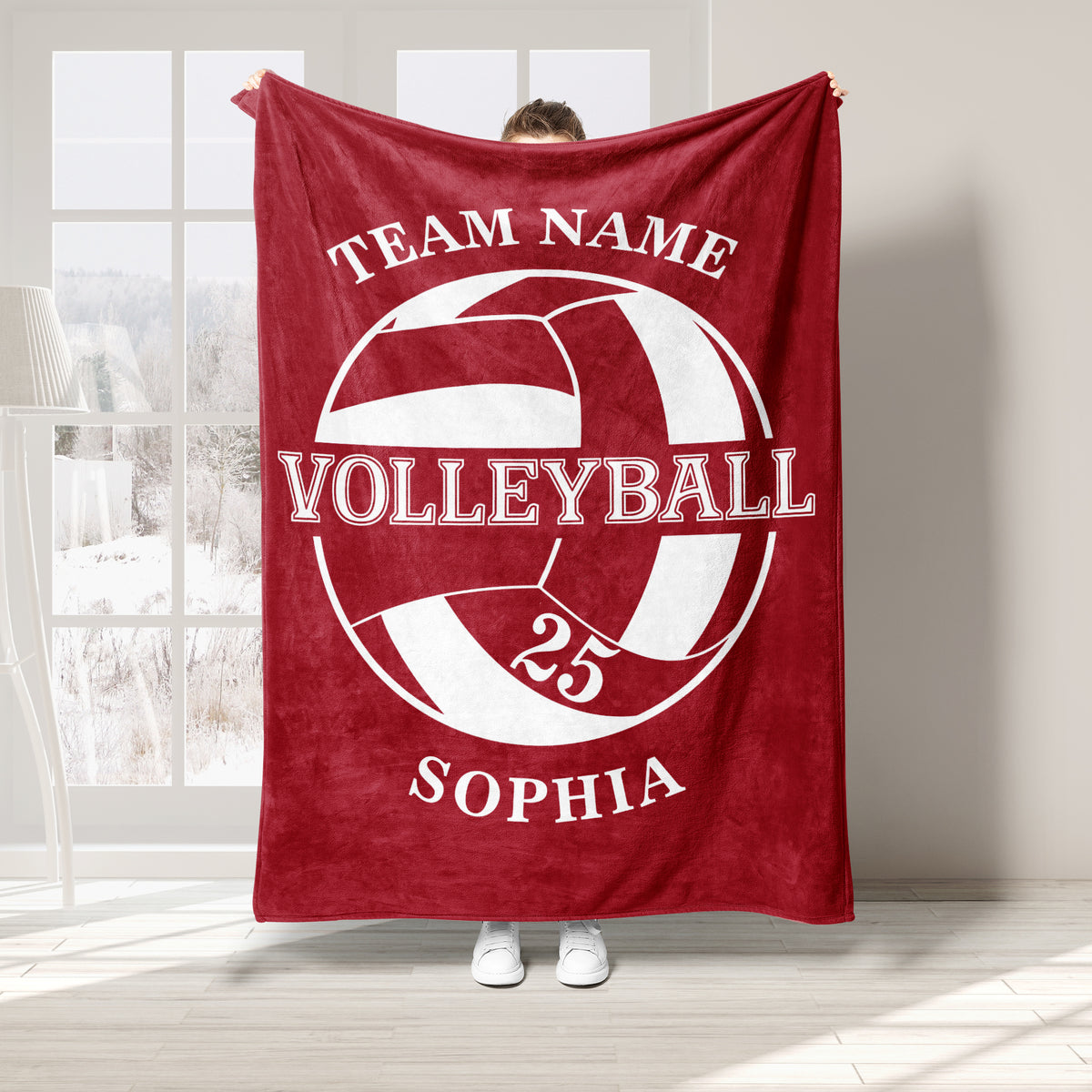 Red volleyball blanket featuring a large white volleyball graphic and team-style sports design