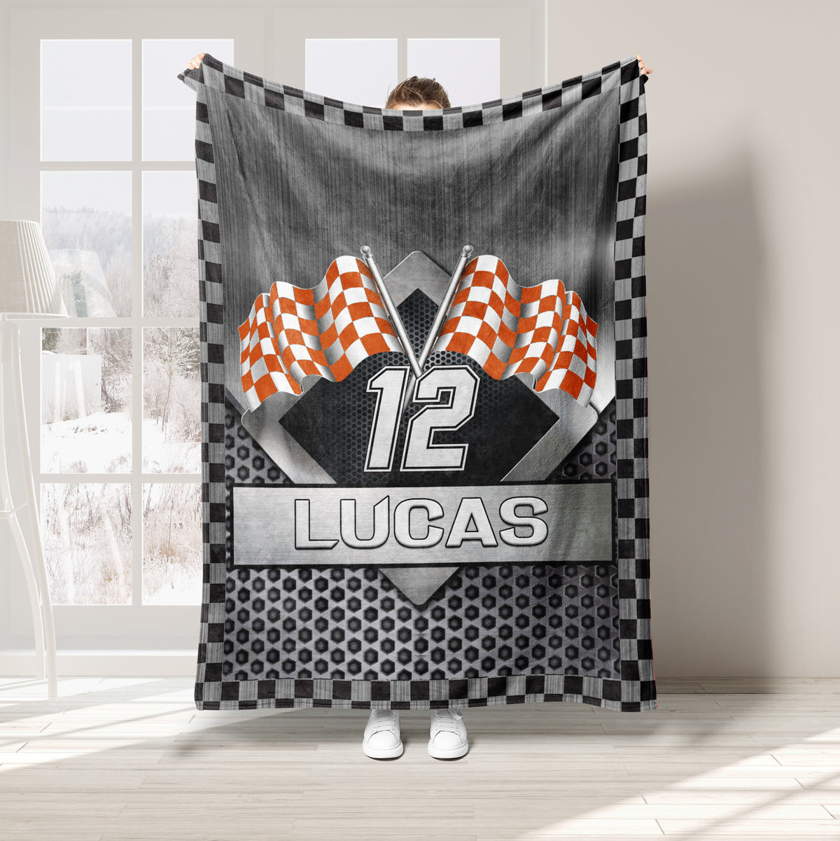 Orange checkered flag racing throw blanket with metallic flagpoles and geometric sports artwork