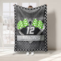 Green checkered flag racing blanket displayed in a bright room with bold motorsport artwork