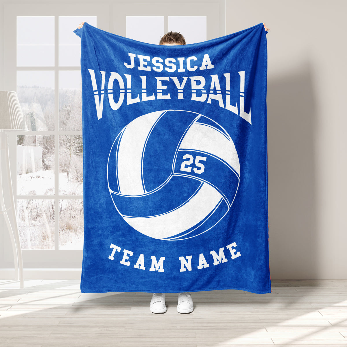 Blue volleyball throw blanket displayed with large white volleyball graphic and bold sports design
