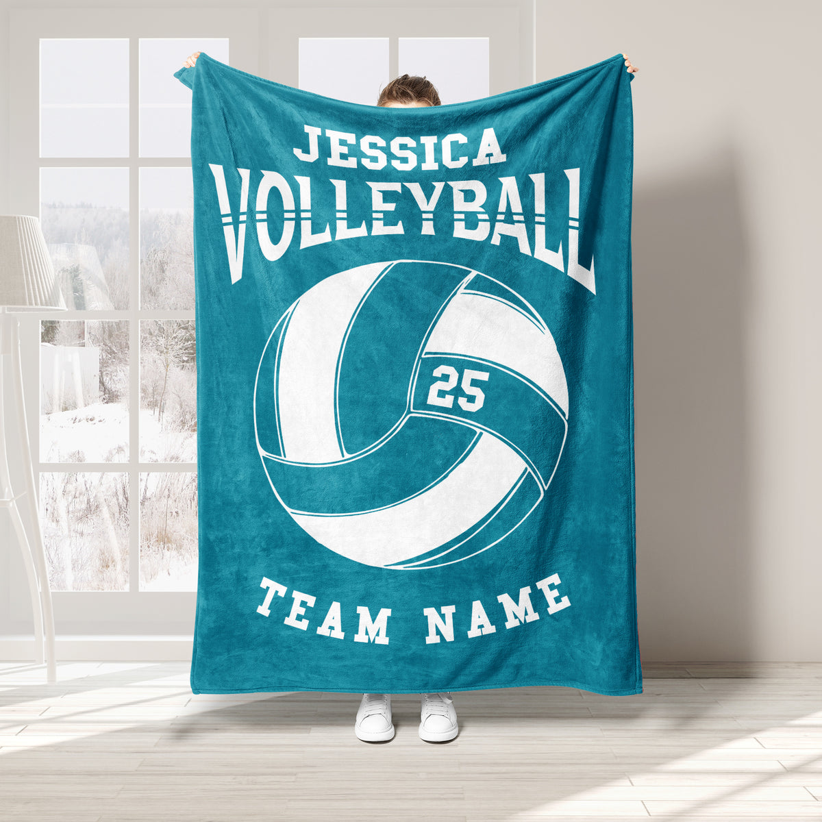 Teal volleyball throw blanket displayed with large white volleyball graphic and athletic design