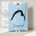 Light blue gymnastics blanket featuring a black silhouette in an arched pose